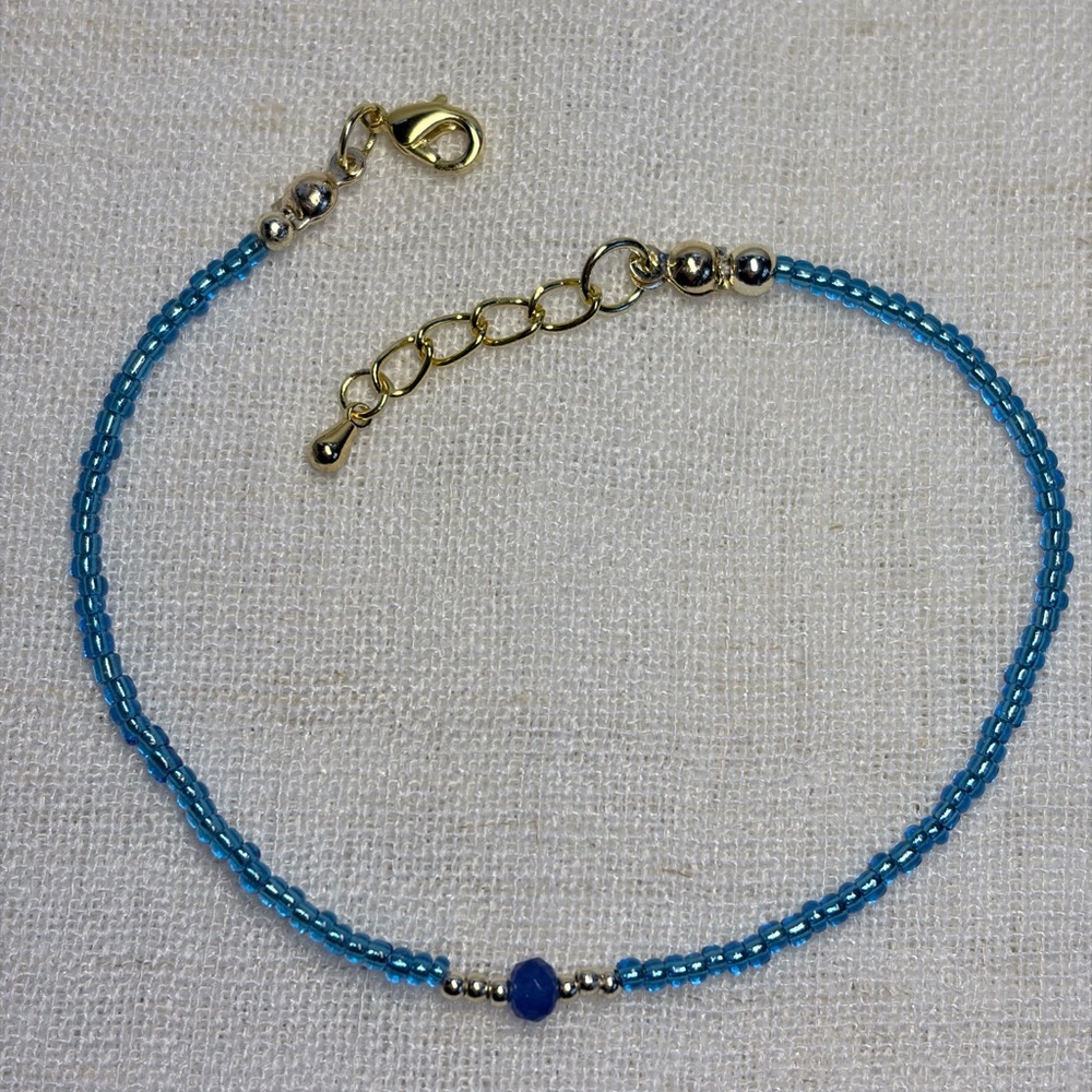 GIFT Bracelet-sky blue seed beads,sapphire blue glass bead,gold spacers.7.5”
